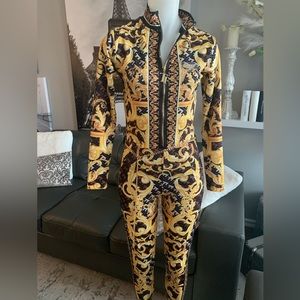 Beautiful jumpsuit.  Size XS-S.  Beautiful print.   Gold belt included.